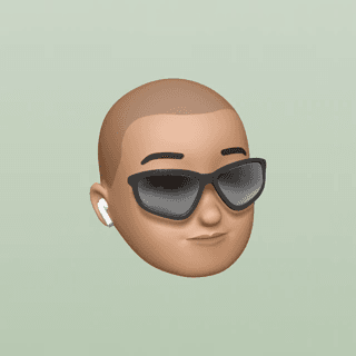 A Memoji of me on a green background